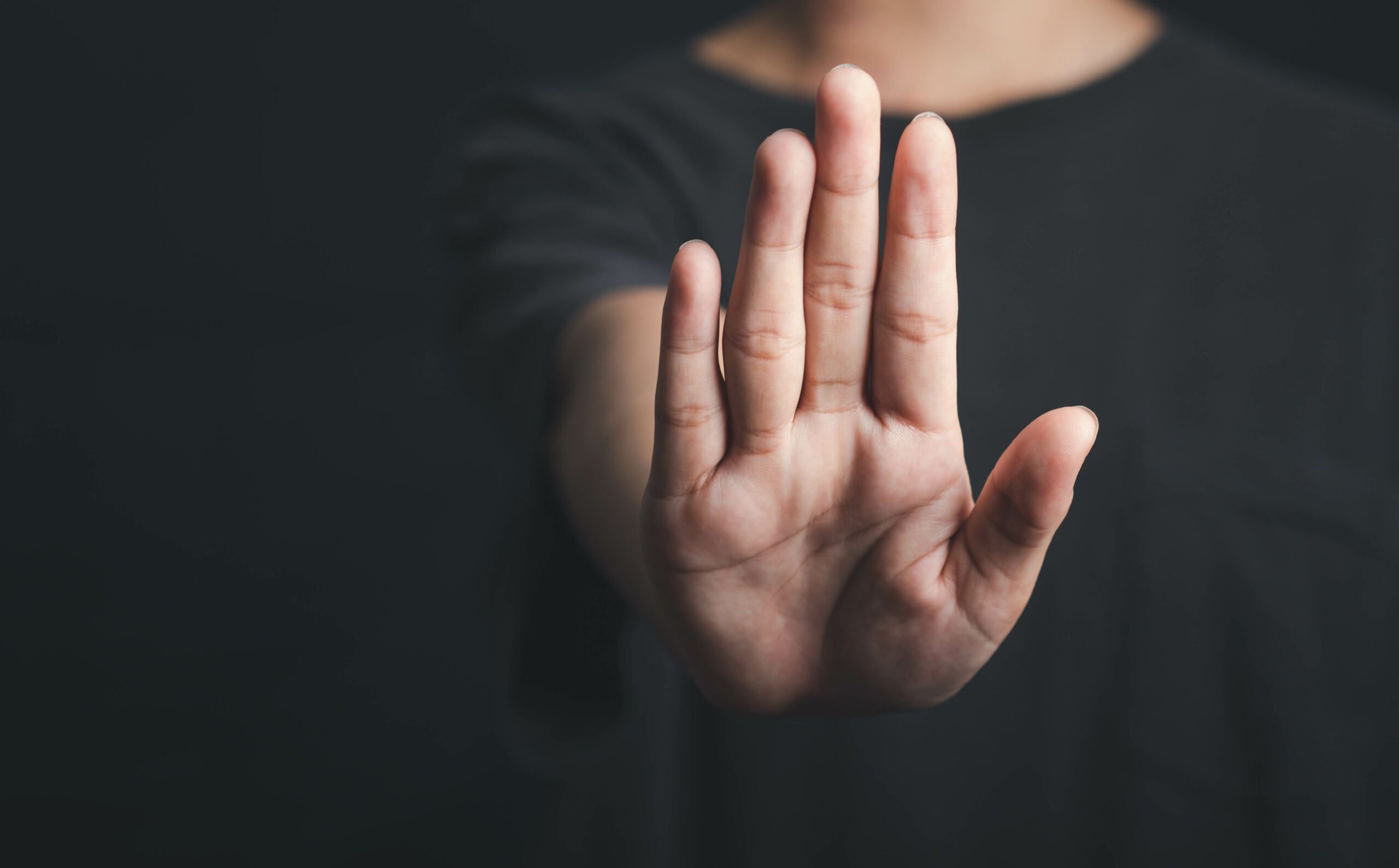 Hand showing stop sign gesture