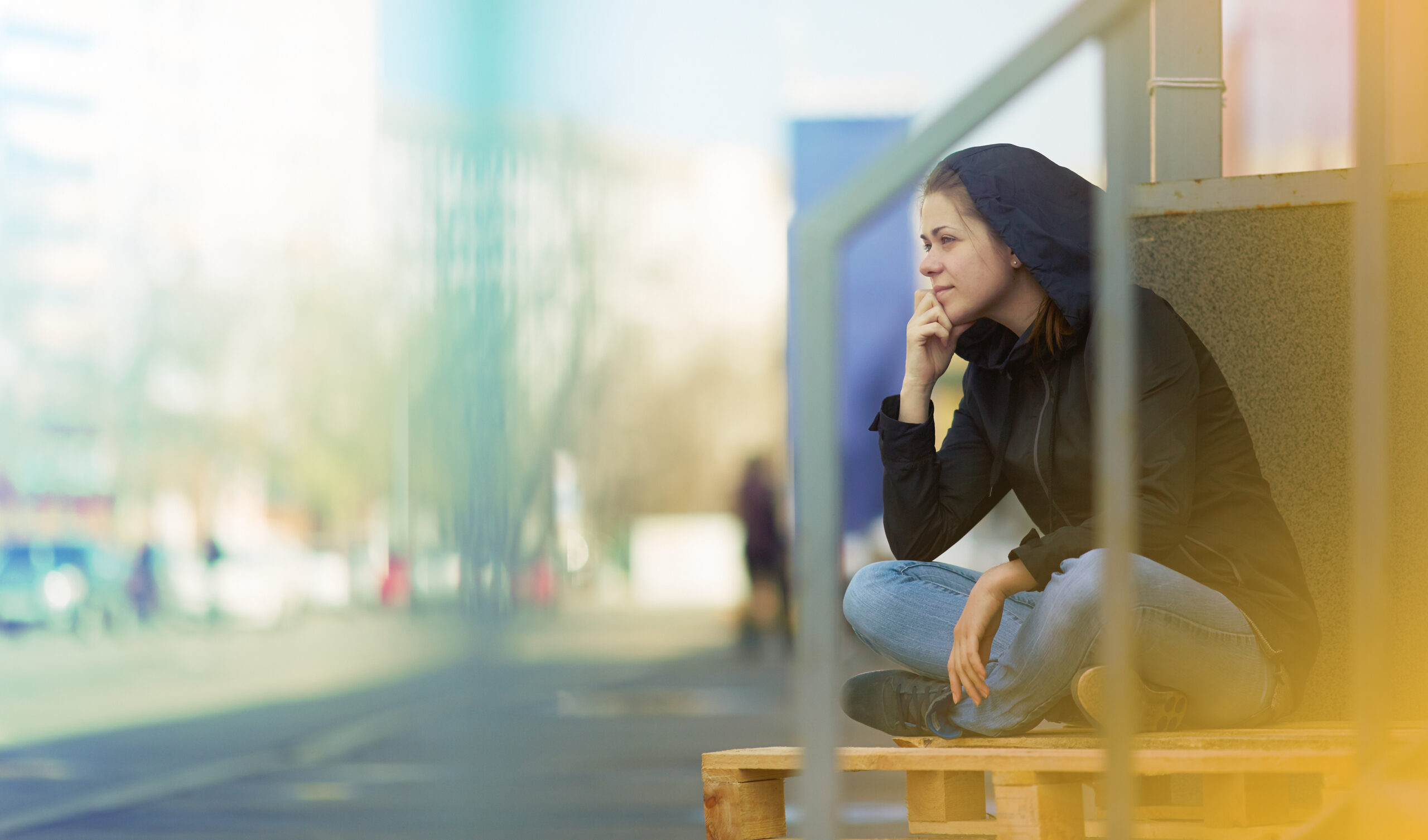 Woman sitting in city
