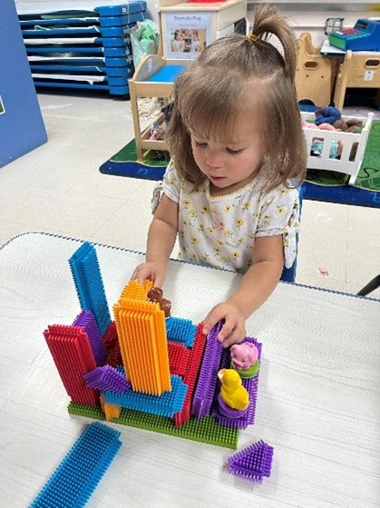Child playing with building blocks