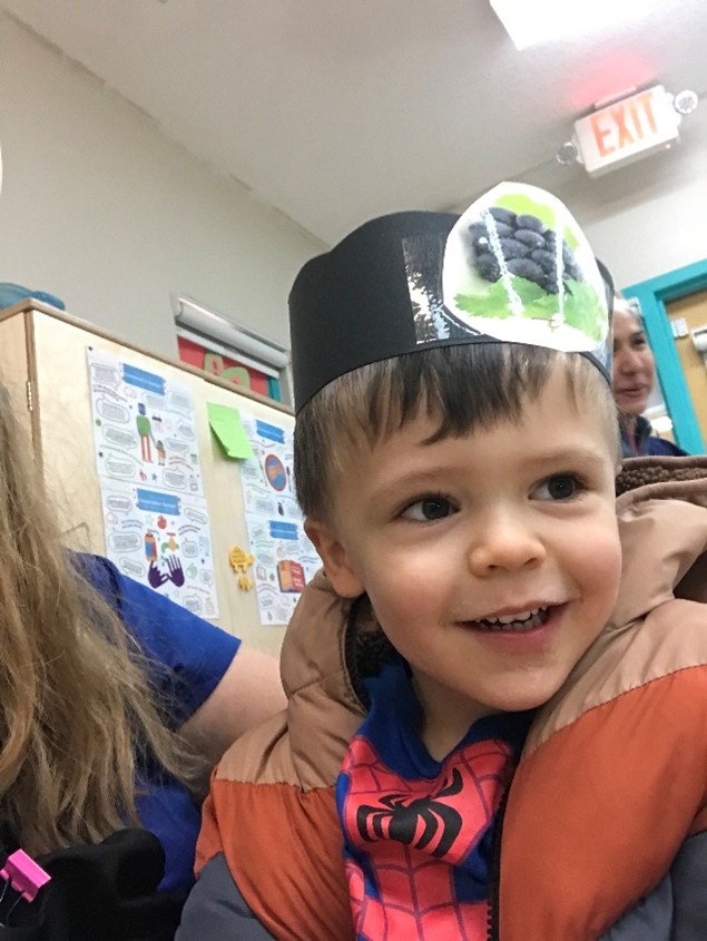 Child wearing paper crown
