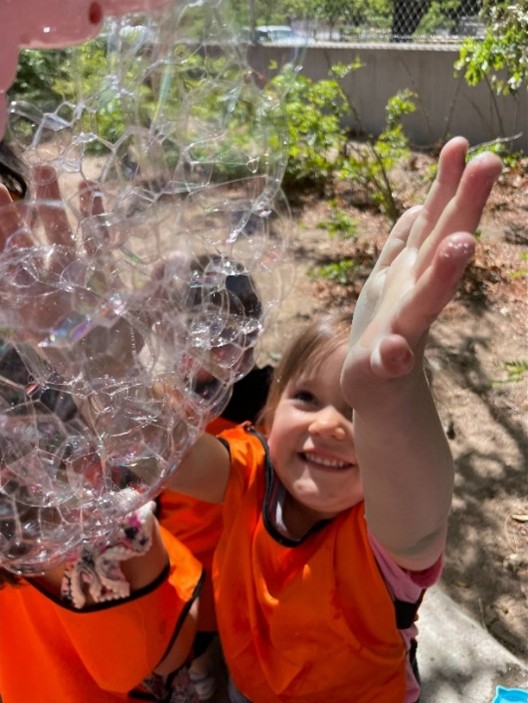 Children playing with bubbles