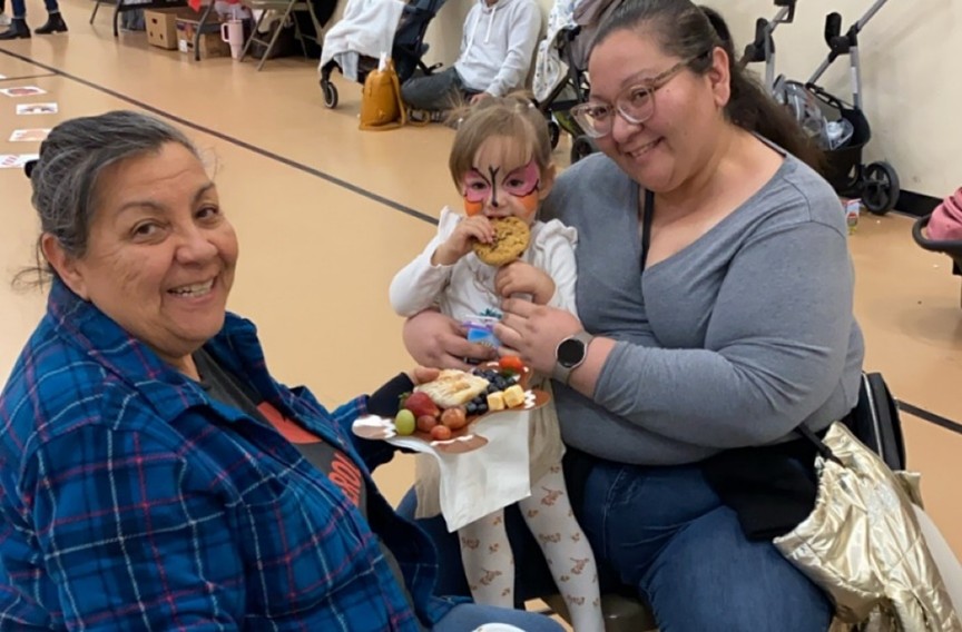 Mother with child eating a cookie