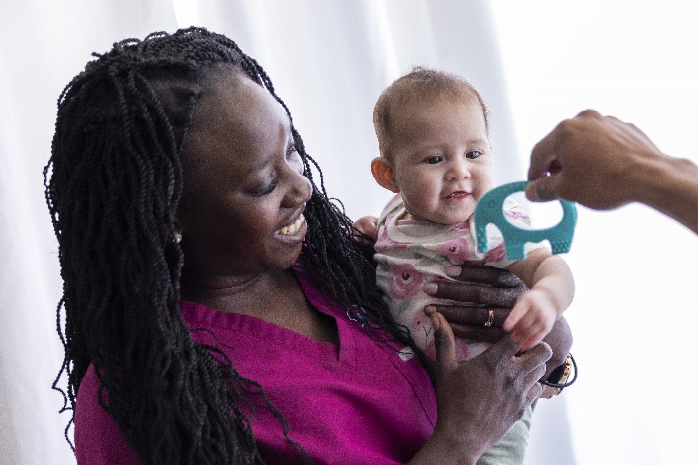 Nurse holding baby